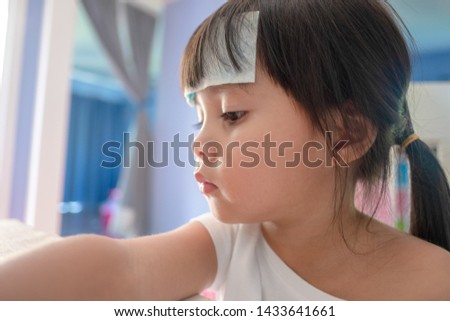 Similar – Funny child looking at the camera and painting