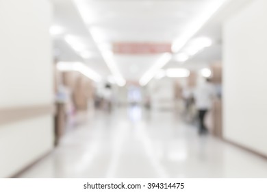 Blur Background Clinic Or Hospital Waiting Hall And Corridor With Patient On Wheelchair Near Nurse Station