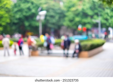 Blur Background : Crowd Of People In City Nature Park.