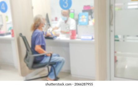 Blur For Background Of Doctor Or Nurse With Syringe Drawing A Blood Sample Of Old Male Patient In Hospital