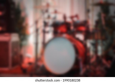 Blur Background Of Empty Abstract Light Illuminated Stage With Drum Kit And Microphone. Drums In Light During Celebrations On Wedding Stage.