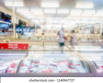 Blur For Background Of Frozen Food Section At Supermarket In Thailand. Huge Glass Door Aisle With Variety Pack Of Processed Pizza. Freezer Full Assortment Of Frozen Food In Supermarket