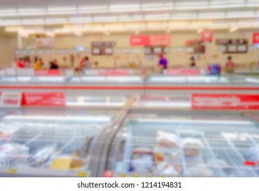 Blur For Background Of Frozen Food Section At Supermarket In Thailand. Huge Glass Door Aisle With Variety Pack Of Processed Pizza. Freezer Full Assortment Of Frozen Food In Supermarket