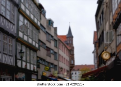 Blur Background Of German City Street With Modern And Ancient Buildings