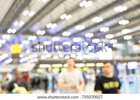 Blur background image of internationnal airport with bokeh and people, background usage concept. 
