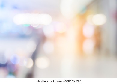 blur background image of shopping mall or department store with bokeh and people background usage concept