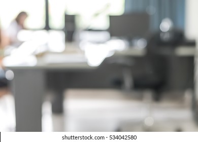 Blur Background Interior Business Office Working Space With Pc Personal Computer Screen In White Room Near Glass Window And Wall