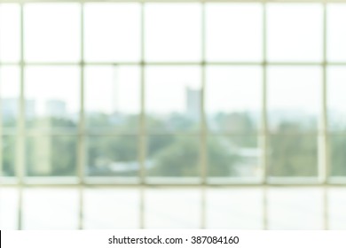 Blur Background Interior View Looking Out Toward To Empty Office Lobby And Entrance Doors And Glass Curtain Wall 