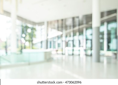 Blur Background Interior View Looking Toward To Empty Luxury Office, Hotel Lobby And Entrance Door And Glass Wall