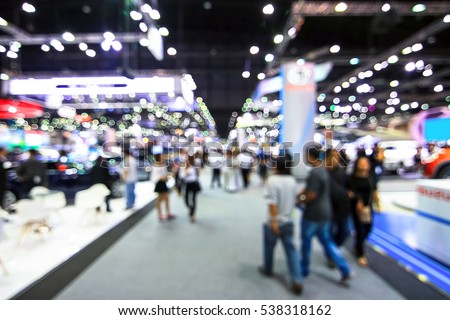 blur background of international motorshow, Bangkok , Thailand. car show room. Abstract blurred image people in international  cars exhibition show in geneva. 