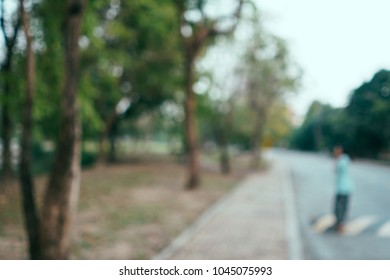 Blur background of a man looking at the trees