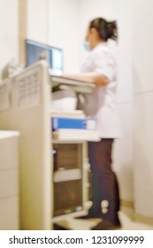 Blur Background Of Medical Exam Room With Nurse Or Technician Working On Mammogram Controller Computer In X-ray For Obstetrician Doctor In Hospital.