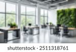 Blur background of office interior with large windows with city urban view, plants, and wooden desks at sunset. Modern workplace and urban greenery concept. Design for poster, wallpaper. Spate.