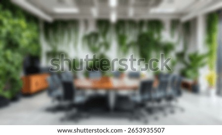 Blur background of office interior with large windows with city urban view, plants, and wooden desks at sunset. Modern workplace and urban greenery concept. Design for poster, wallpaper. Spate.
