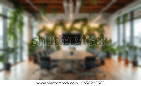 Blur background of office interior with large windows with city urban view, plants, and wooden desks at sunset. Modern workplace and urban greenery concept. Design for poster, wallpaper. Spate.