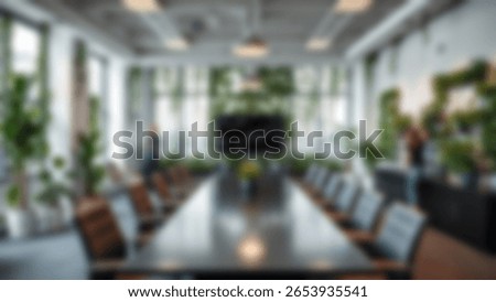 Blur background of office interior with large windows with city urban view, plants, and wooden desks at sunset. Modern workplace and urban greenery concept. Design for poster, wallpaper. Spate.