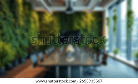 Blur background of office interior with large windows with city urban view, plants, and wooden desks at sunset. Modern workplace and urban greenery concept. Design for poster, wallpaper. Spate.