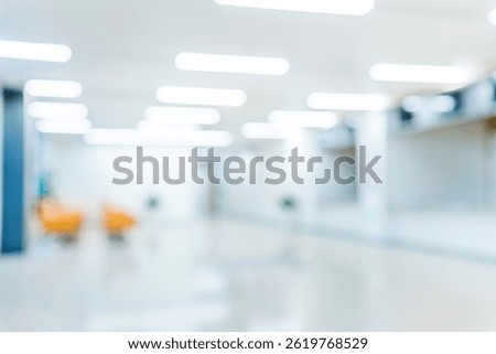 Blur background of orange sofas in modern hospital waiting room