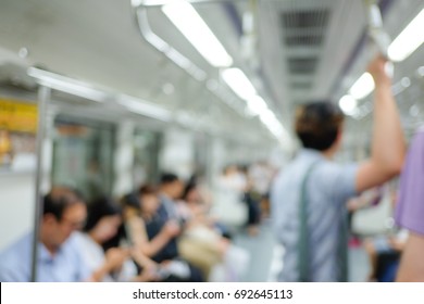 blur background of passengers in subway in Seoul, Korea