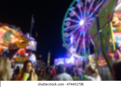 Blur Background Of People At County Fair At Night                            