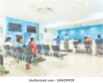 Blur Background Of People Sit Down Wait Bank Teller Cashier Counter In Office Building Lobby For Background