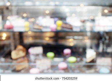 Blur Background Showcase With Cakes. Pastry Shop. Variety Of Cakes