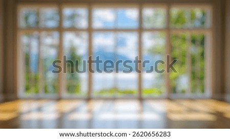 Blur Background of Spacious Bright Interior With Large Windows Overlooking Scenic Landscape and Calm Lake View in Nature. Defocused Image for Background.