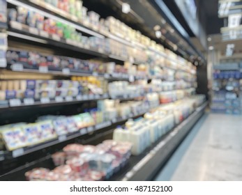 Blur Background Supermarket Place With Dairy Products Food And Beverage On Refrigerator Shelves