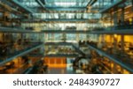 Blur background of traditional office setup with rows of desks and natural lighting. Corporate office interior photography. Functional office space concept. Design for corporate brochures. Spate.