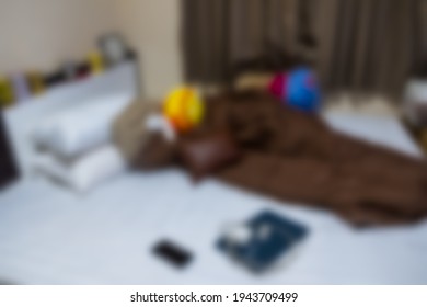 Blur Background Of Very Messy And Cluttered Teenage Boy's Bedroom