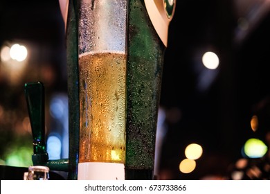 blur background wallpaper closeup beer tower with bokeh at the night bar