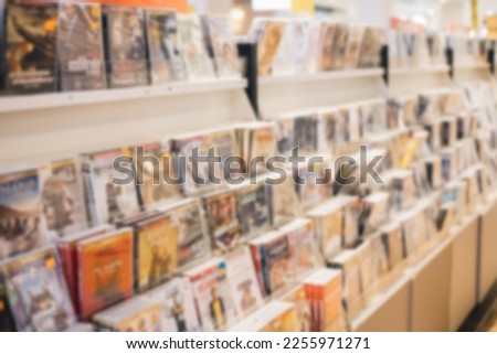 Blur backgrounds of CD,DVD shop , discount retail stores. Assorted DVD's on sale.