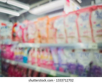 Blur Bags And Bottles Of Detergent, Comforter And Other Cleaning Products For Sale In A Convenience Store