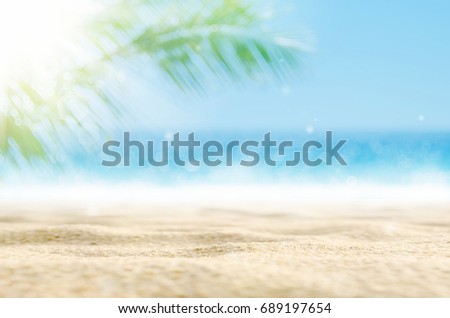 Similar – Image, Stock Photo Sandy beach with blurred background, with setting sun and bokeh