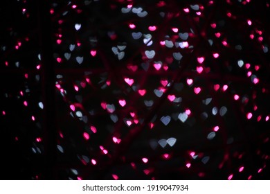 blur bokeh hearts shape pink   white and dark background 