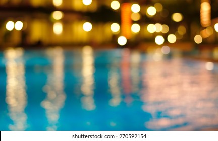 Blur Bokeh Night Light Reflection In Summer Swimming Pool Christmas Party Blue Water Abstract Background