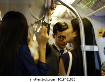 Blur: The Business Man And Woman Travel By Subway Train In The Morning Time. 