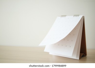 Blur Calendar page flipping sheet on wood table background business schedule planning appointment meeting concept - Shutterstock ID 1799984899