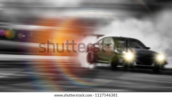Blur of Car drifting, Sport car wheel\
drifting and smoking on blurred\
background.