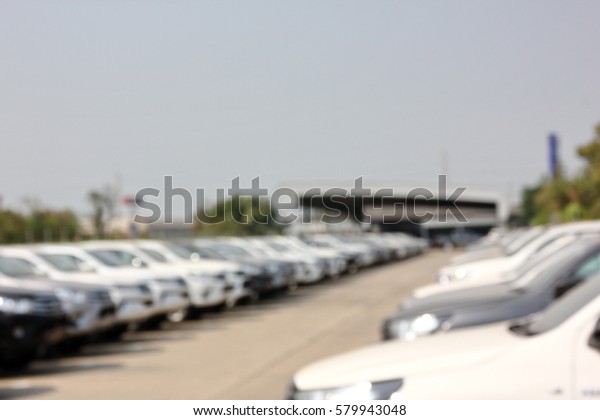 blur car in stock car\
yard of dealer 