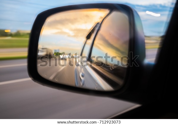 The blur of the car\'s side mirrors and the\
inside look like a\
heart-shaped.