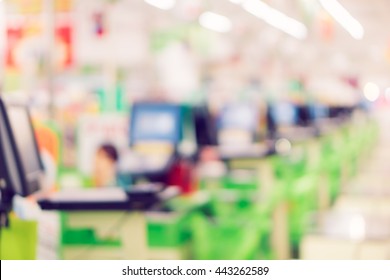 Blur Cashier Counter In The Supermarket,Cashier At A Supermarket Checkout In A Department Store.