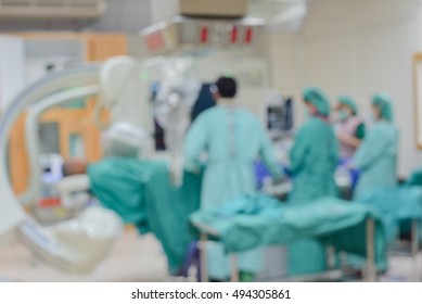 Blur Cath Lab in modern hospital with doctor, nurse and patient.