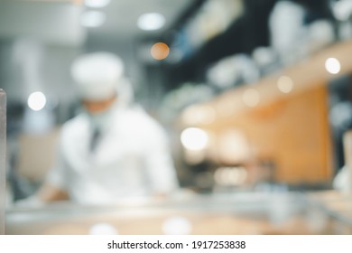 Blur Chef Cooking At The Kitchen Counter And Directly Serve To Customers In The Background. Japanese Omakase Restaurant Counter