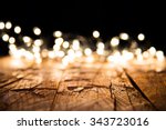 Blur christmas lights on wooden planks, low depth of focus with copyspace