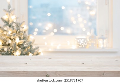 Blur Christmas tree and decorated window interior background with wooden table top for product display in front