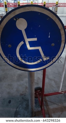 blur closeup sign handicapped parking on road background