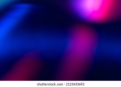 Blur color flare. Neon glow background. Bokeh radiance reflection. Defocused fluorescent blue pink light gleam on dark abstract overlay.