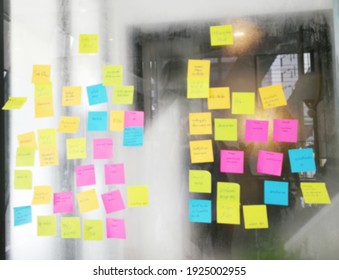 Blur Color Notes Or Sticky Note On The Glass Wall In The Office During Brainstorming Session In Ideation Workshop Of Design Thinking