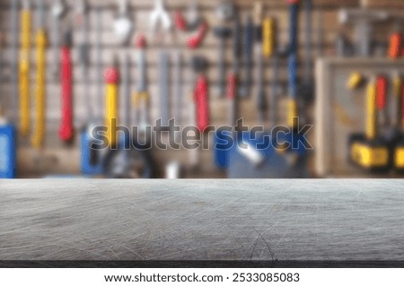 Blur craft workshop interior and empty metal table top with space for products.